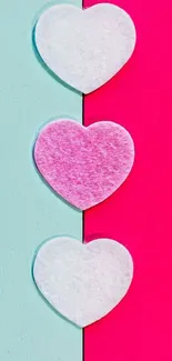 Vibrant mobile wallpaper with pink and turquoise hearts.