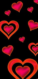 Vibrant red and orange glowing hearts on black background wallpaper.