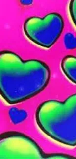 Colorful wallpaper with green and blue hearts on a pink background.