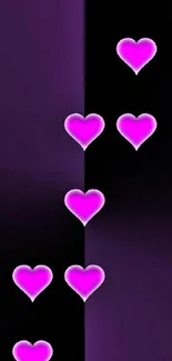 Wallpaper with vibrant purple hearts on a dark background.