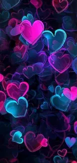 Neon hearts wallpaper with dark background, pink and blue colors.