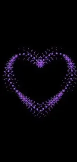 Purple neon heart on black background wallpaper.