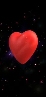 Red heart on a starry black night background.