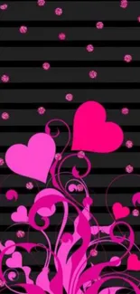 Black striped wallpaper with pink hearts and swirls.