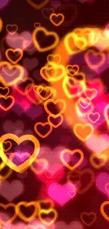 Vibrant pink and orange heart pattern wallpaper.