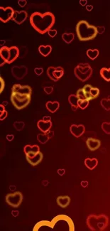 Vibrant wallpaper with glowing red and orange hearts on a dark background.