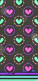 Mobile wallpaper with colorful heart patterns on a black background.