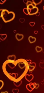 Vibrant mobile wallpaper with glowing red and orange hearts on a dark background.