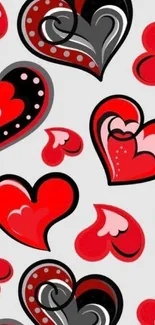 Colorful wallpaper with red and black heart patterns on a white background.