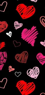 Colorful doodle hearts on black wallpaper background.