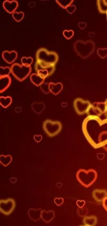 Mobile wallpaper with glowing red and orange heart pattern.