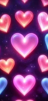 Vibrant hearts in pink, blue, and red glow on a dark background.