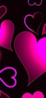 Bright pink hearts pattern on a dark background.