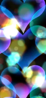 Vibrant heart wallpaper with glowing blue, purple, and green abstract design.