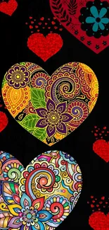 Colorful floral hearts on a black background wallpaper.