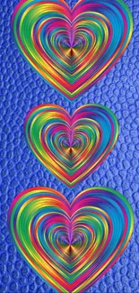 Colorful layered hearts on a blue textured background.