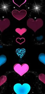 Vibrant pink and blue hearts wallpaper on a dark background.