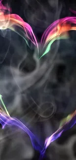 Heart-shaped colorful smoke art on black mobile wallpaper.