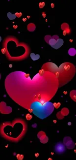 Mobile wallpaper with glowing pink and red hearts on black background.