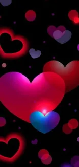 Colorful hearts on a black background wallpaper.