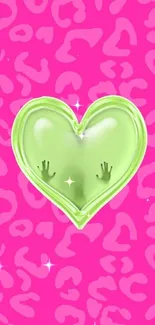 Neon green heart on pink leopard print wallpaper.