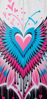 Colorful graffiti of a heart with wings in pink and blue hues.