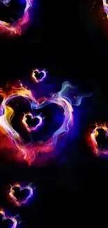 Colorful fiery heart designs on a black background wallpaper.