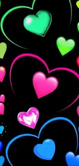 Neon hearts wallpaper with black background.