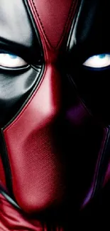 Red and black superhero in mask mobile wallpaper, focusing on intense eyes.