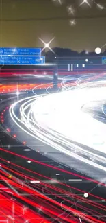 Vibrant red and white light trails on a highway at night.