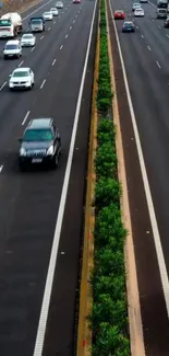 A bustling highway with cars and greenery, ideal for urban-themed phone backgrounds.