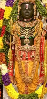 Vibrant Hindu deity adorned with colorful garlands and gold attire.