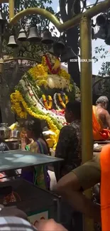 Hindu temple with devotees and floral decorations.