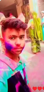 Holi celebration selfie with colorful powder and traditional attire.