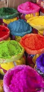 Colorful Holi powders forming a vibrant and lively wallpaper.