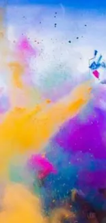 Colorful Holi festival powder explosion wallpaper with vibrant yellows and purples.