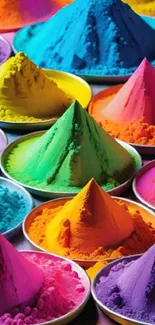 Colorful Holi powder cones arranged in vibrant piles.