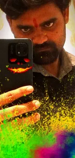 Vibrant Holi powder selfie with emoji phone design.