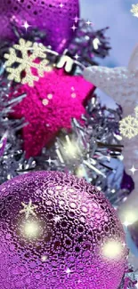 Festive wallpaper with purple holiday baubles and silver tinsel accents.