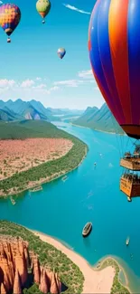 Hot air balloons float over a scenic river landscape with mountains.