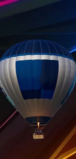 Colorful hot air balloon against abstract background.