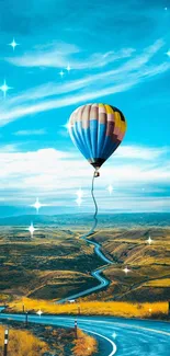 A colorful hot air balloon floats over a winding road with a vibrant sky backdrop.