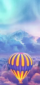 Hot air balloon floats above vibrant clouds and mountains.