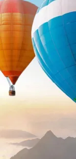 Colorful hot air balloons float over mountains.