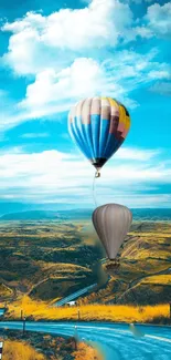 Colorful hot air balloons float in a vivid sky above a scenic landscape.