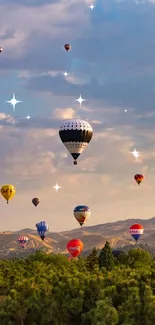 Colorful hot air balloons above lush green and mountainous landscape.