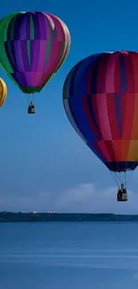 Colorful hot air balloons soaring in a clear blue sky.