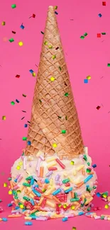 A colorful ice cream cone with sprinkles on a pink background.