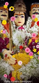 Colorful Indian deity with vibrant floral arrangement.