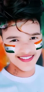 Mobile wallpaper featuring Indian flag face art on a smiling youth.